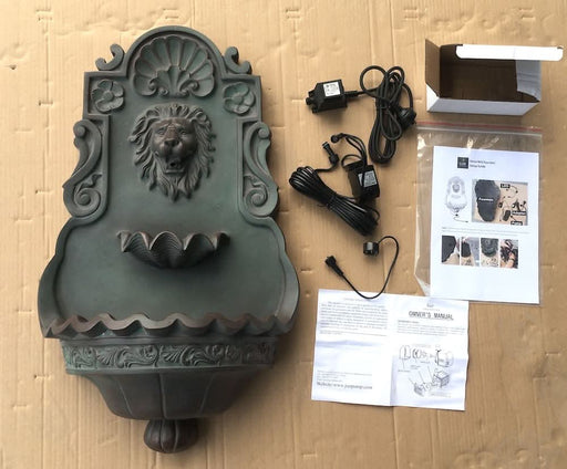 Wall fountain with pump and paper manual.