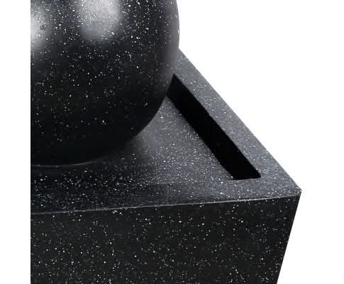 A black solar water feature closeup top view.