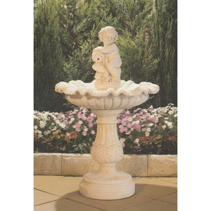 A concrete fountain with cherub boy.