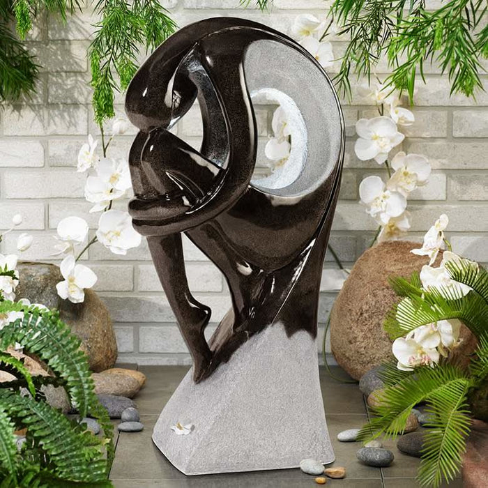 large arc water feature with background