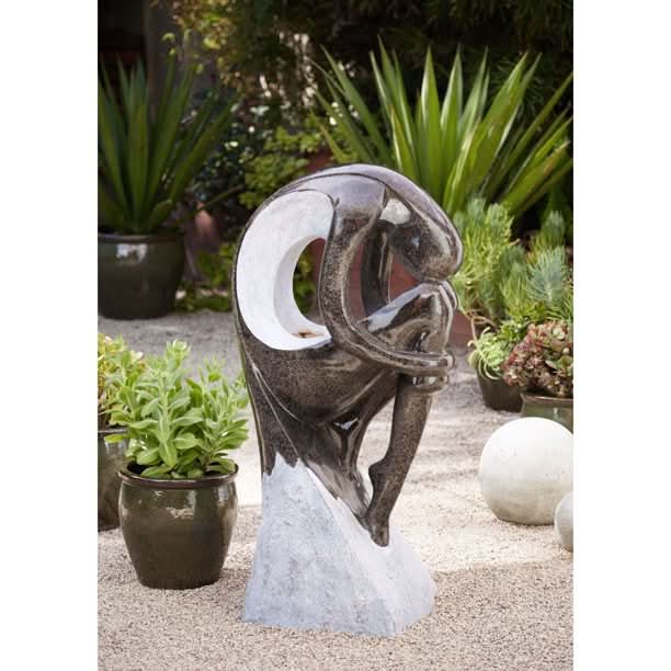 large arc water feature posing right