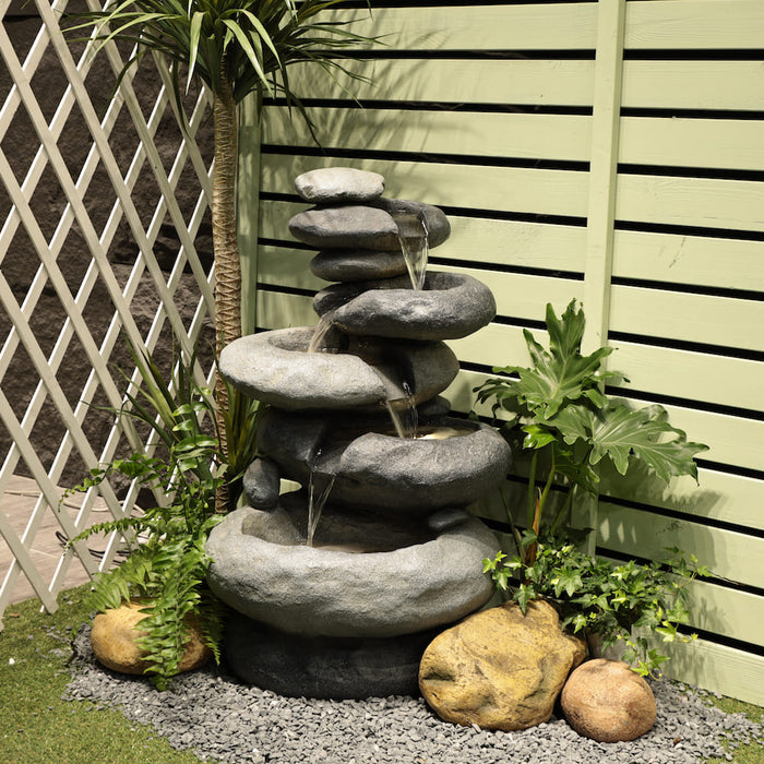 A rock styled water feature with 5-tier bowls.