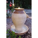 Ceramic urn water feature with LED light at dusk.