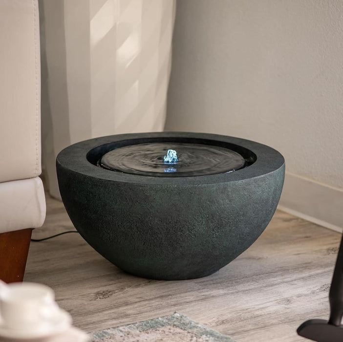 Charcoal colour bowl water feature in the living room.