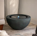 Charcoal colour bowl water feature in the living room.