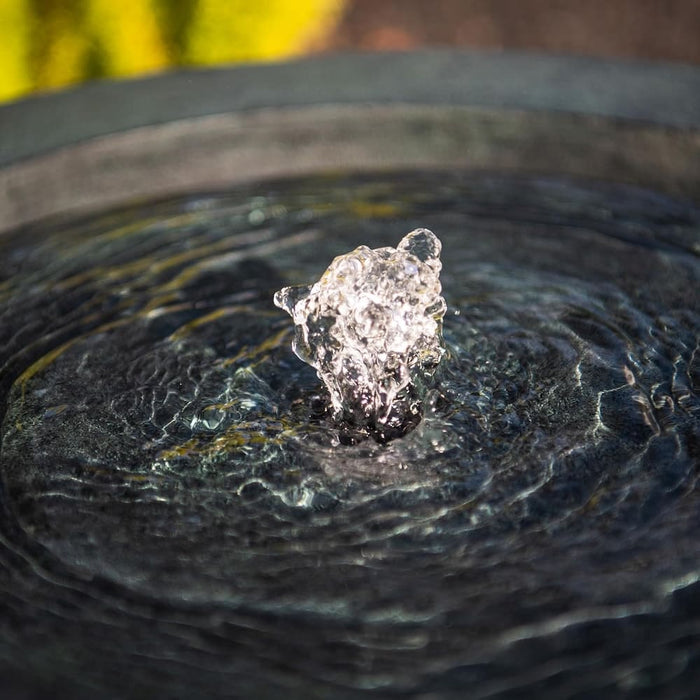 Close up view of the bubbling effect of a bowl water feature.