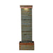 Full view of tall slate water fountain with ribbed stone texture, copper trim, and warm LED lighting at the top.