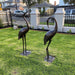 A pair of statue cranes.