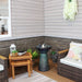 A ceramic birdbath fountain placed on the outdoor deck.