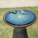 Close up view of the top of a ceramic birdbath fountain.