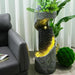 Indoor abstract water fountain with LED lights and planter, modern home decor.