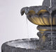 Decorative water fountain with flowing water 