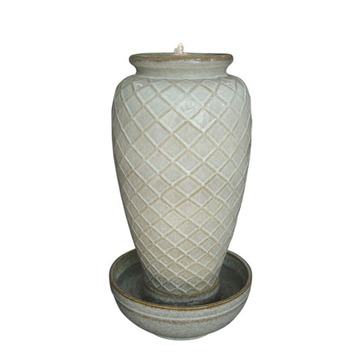 A tall vase fountain in ivory white.
