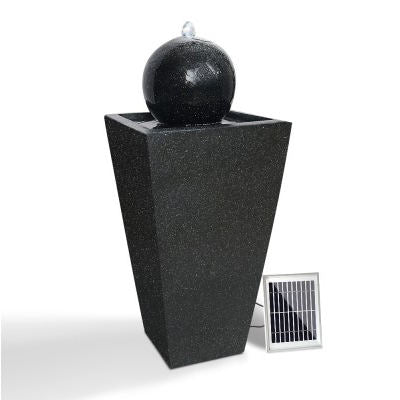 A black solar water feature with white background.