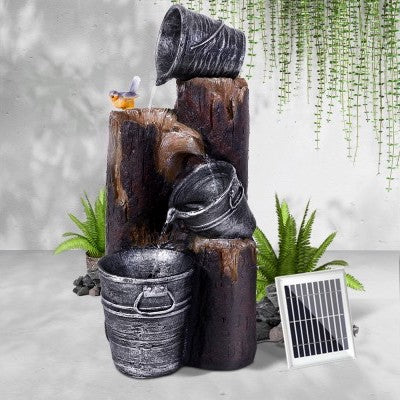A wood themed water feature with 3 buckets.