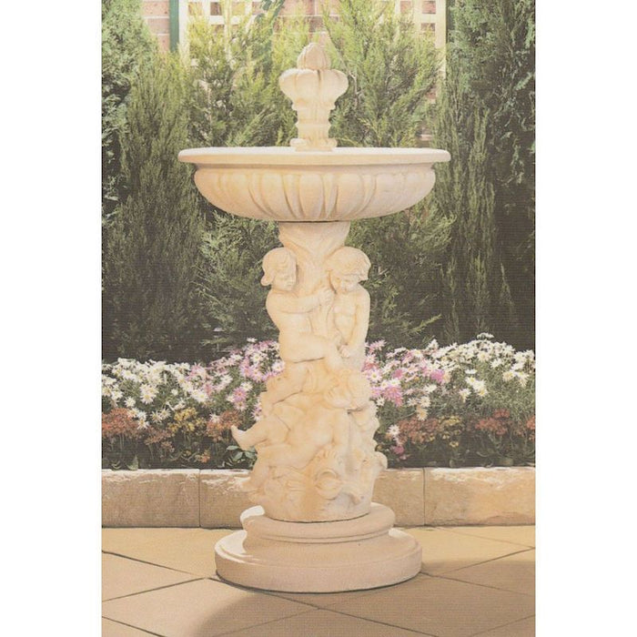 A concrete bird bath fountain with cherubs on its pedestal.