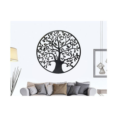 Metal wall art with tree design hung in living room.