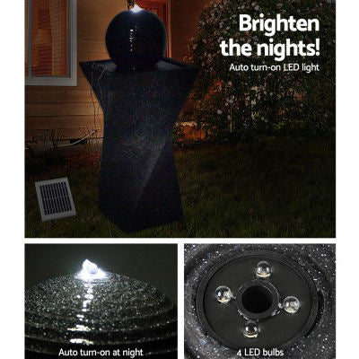 twist shaped outdoor fountain at night